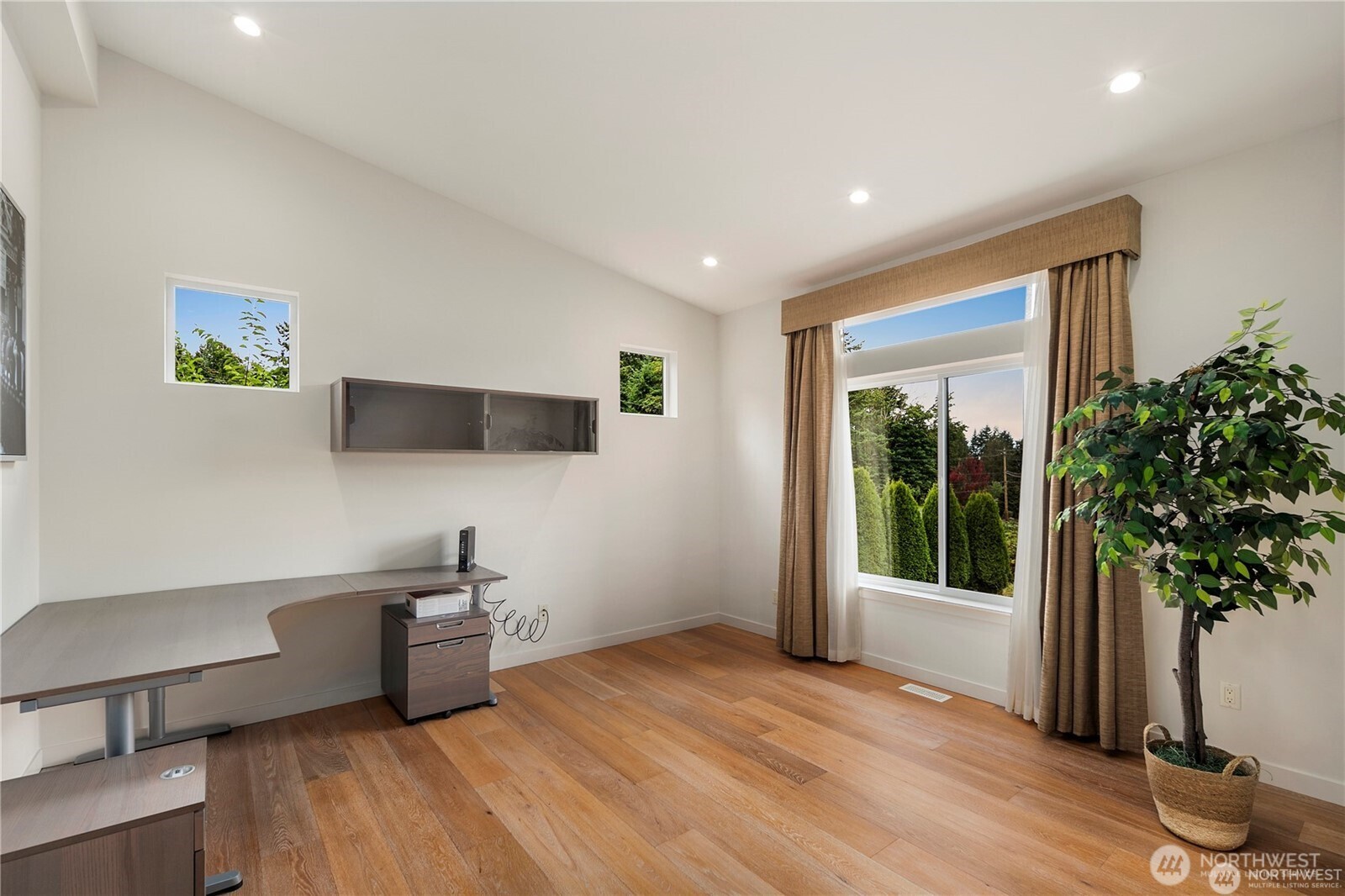 30404 28th Avenue Southwest Federal Way, WA 98023 - Photo 9 of 24 a kitchen with stainless steel appliances a white stove top oven a counter space and a potted plant