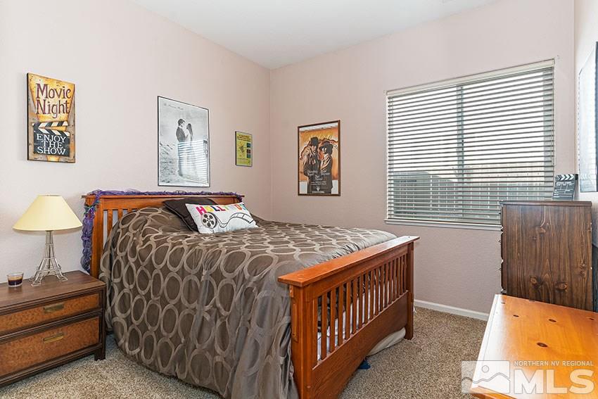 10220 Donnay Court Reno, NV 89521 - Photo 12 of 19 a bedroom with a bed and a window