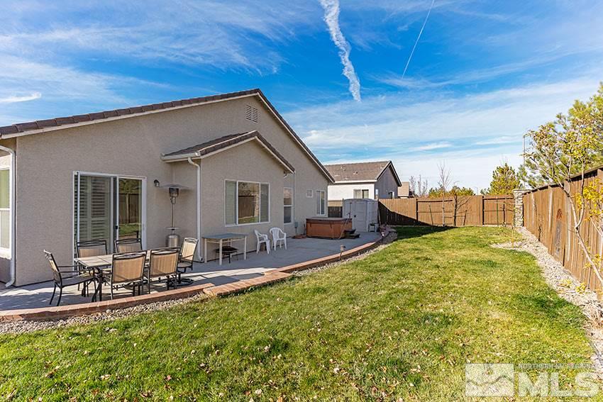 10220 Donnay Court Reno, NV 89521 - Photo 15 of 19 a front view of house with yard patio and outdoor seating