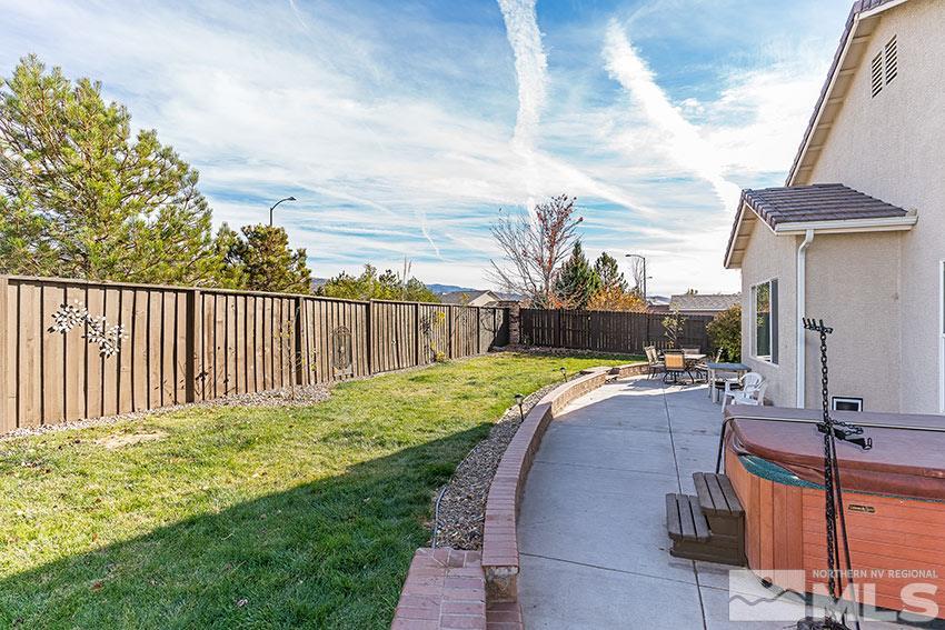 10220 Donnay Court Reno, NV 89521 - Photo 16 of 19 a view of a backyard with sitting area