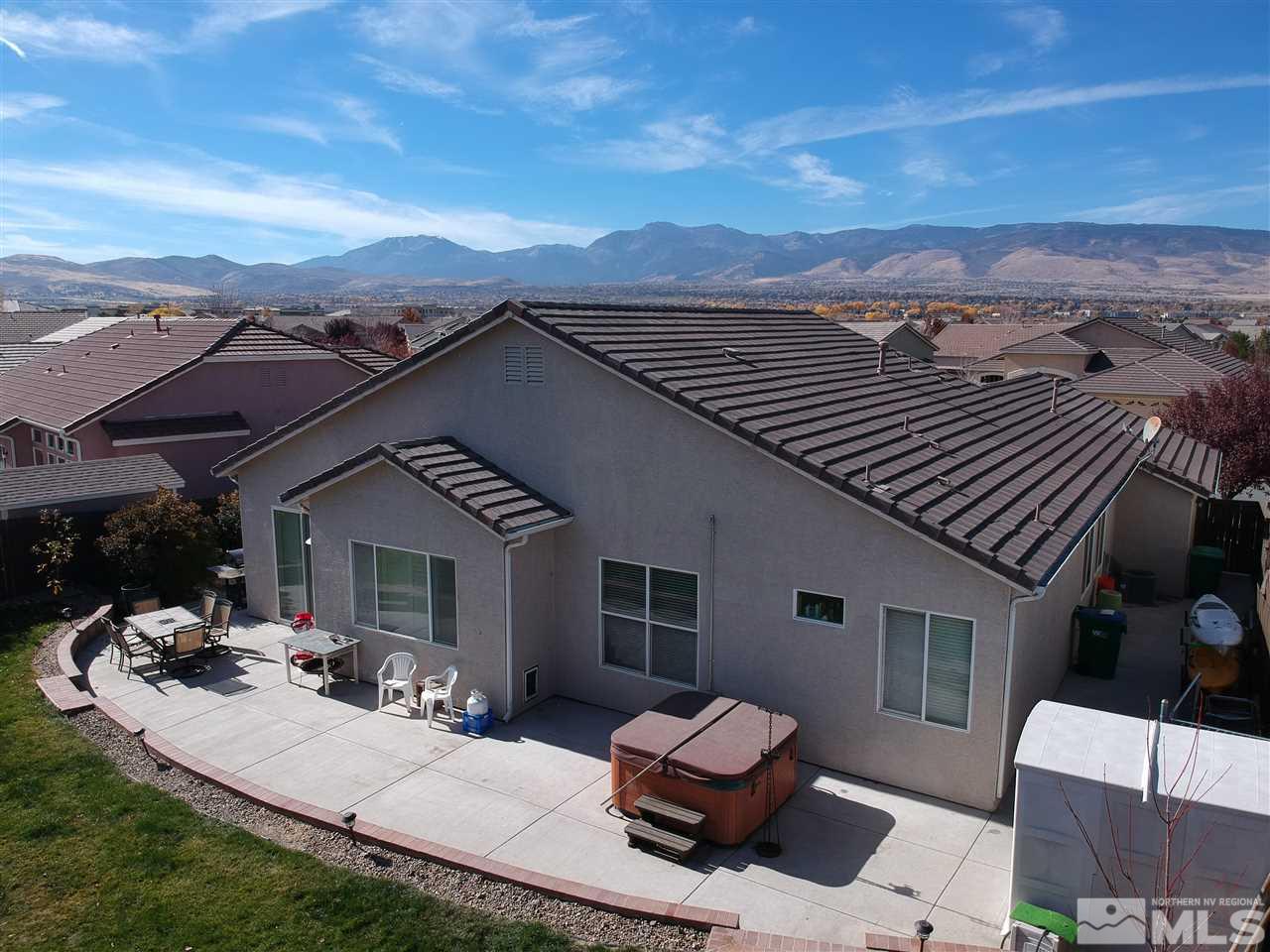 10220 Donnay Court Reno, NV 89521 - Photo 2 of 19 a view of a patio with couches table and chairs and potted plants