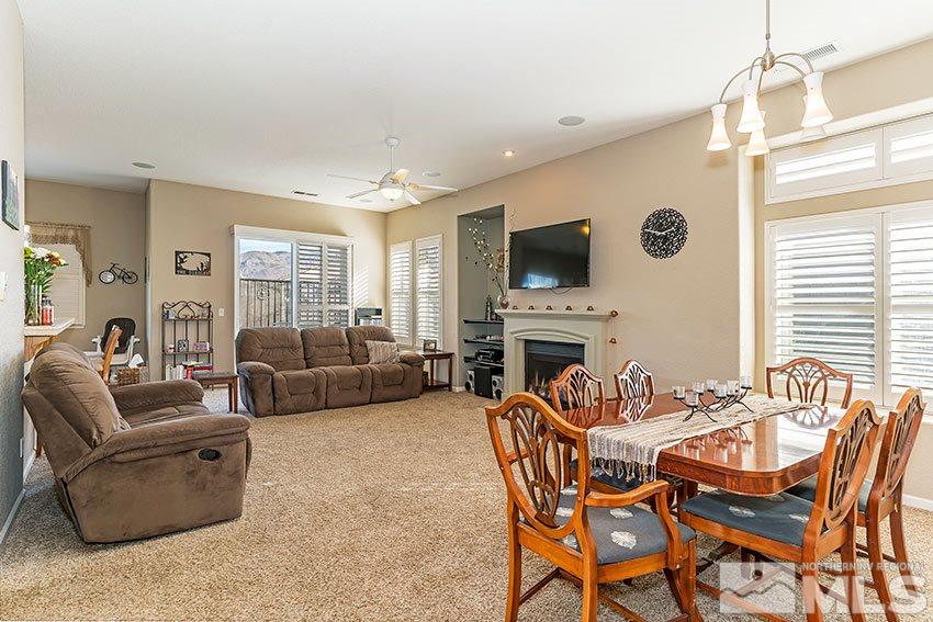 10220 Donnay Court Reno, NV 89521 - Photo 5 of 19 a living room with fireplace furniture and a flat screen tv
