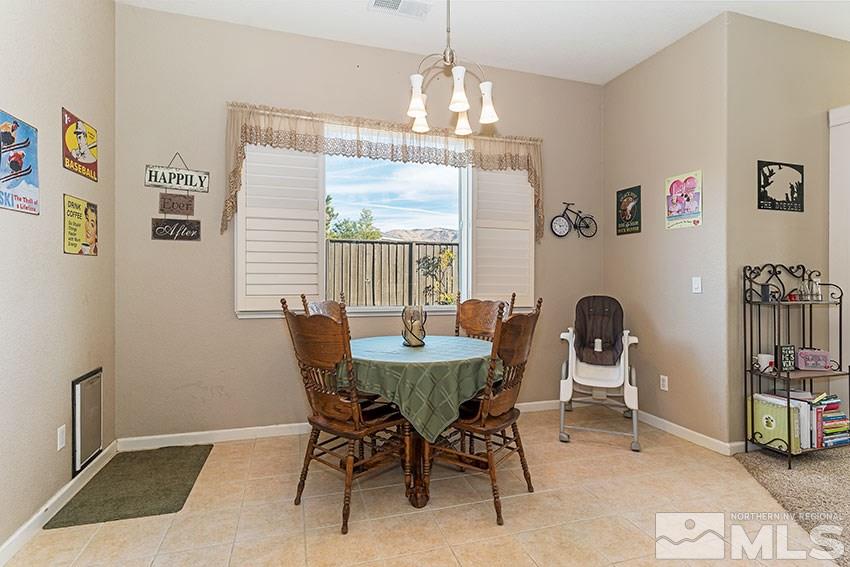10220 Donnay Court Reno, NV 89521 - Photo 9 of 19 a view of a dining room with furniture and chandelier