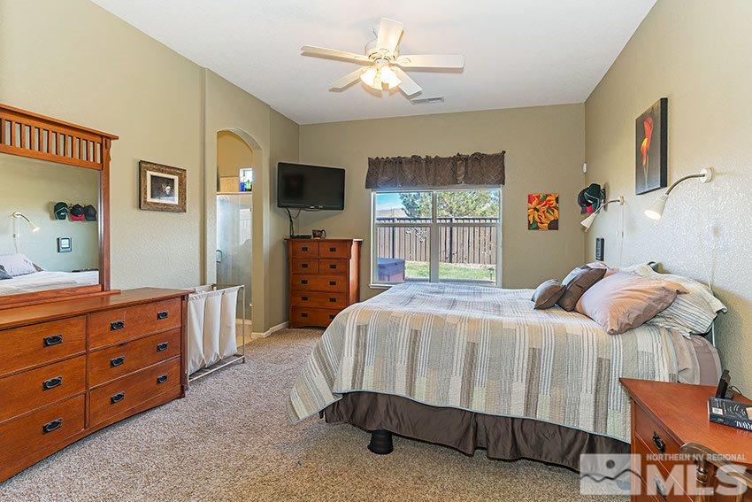 10220 Donnay Court Reno, NV 89521 - Photo 10 of 19 a bedroom with a bed and a dresser in it