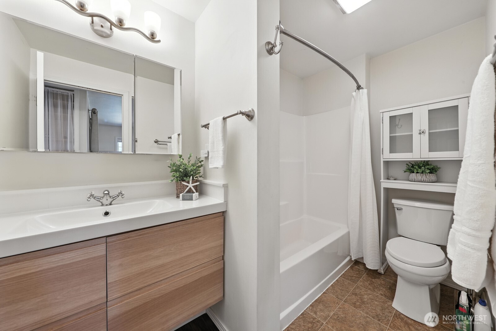 805 36th Street Anacortes, WA 98221 - Photo 16 of 39 a bathroom with a sink a toilet and shower
