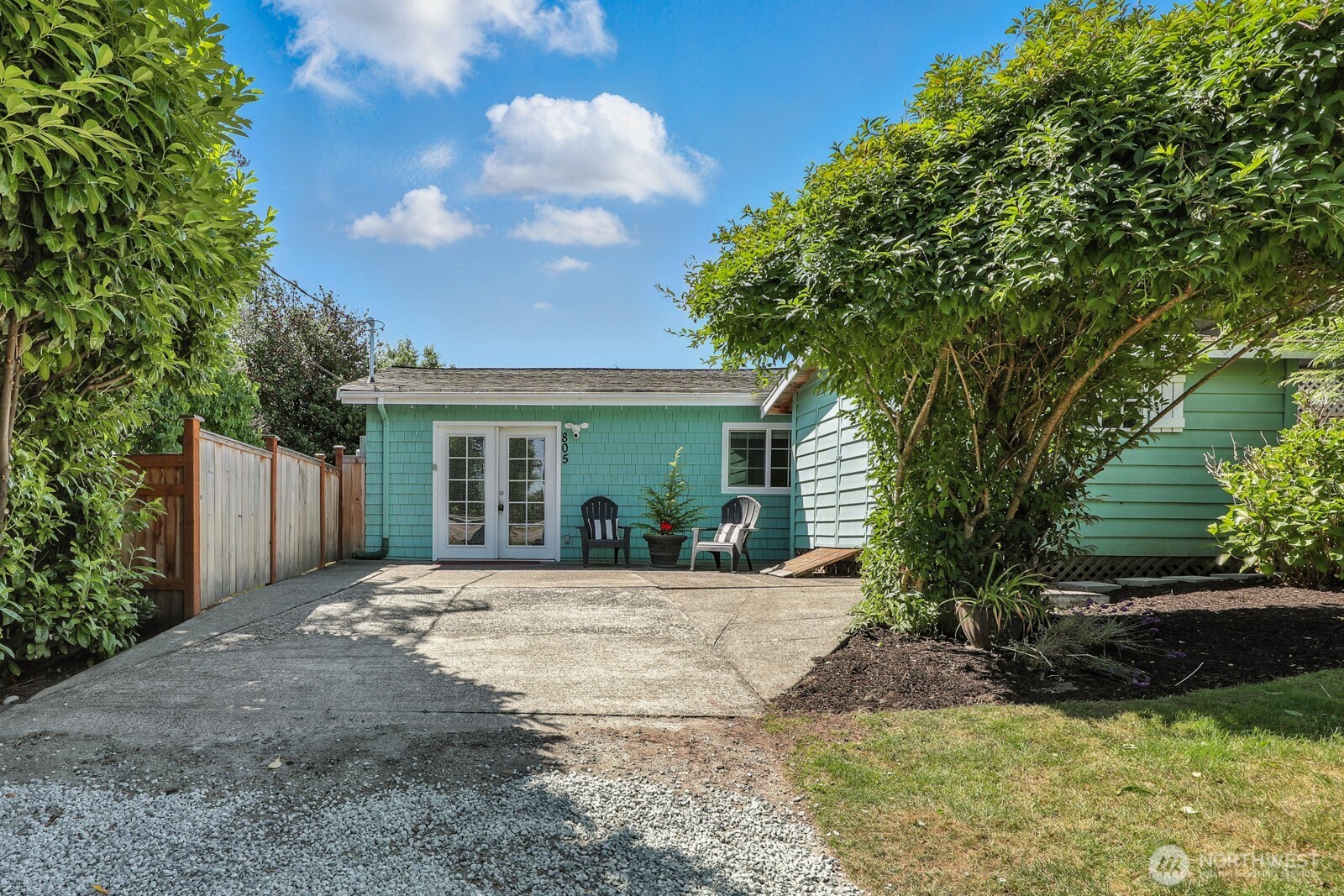 805 36th Street Anacortes, WA 98221 - Photo 2 of 39 a front view of a house with a yard and porch