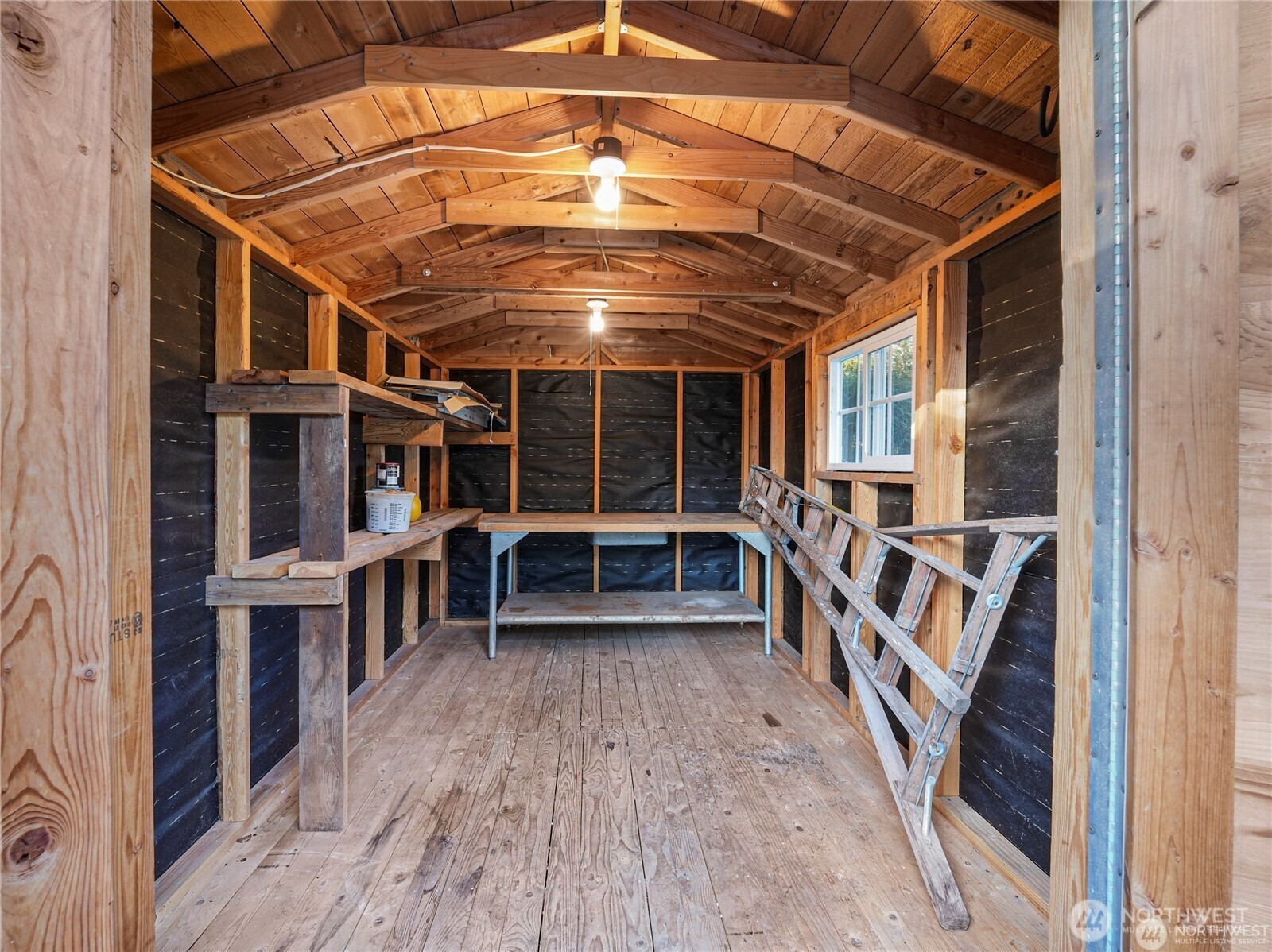 805 36th Street Anacortes, WA 98221 - Photo 26 of 39 a view of an empty room with wooden floor and furniture