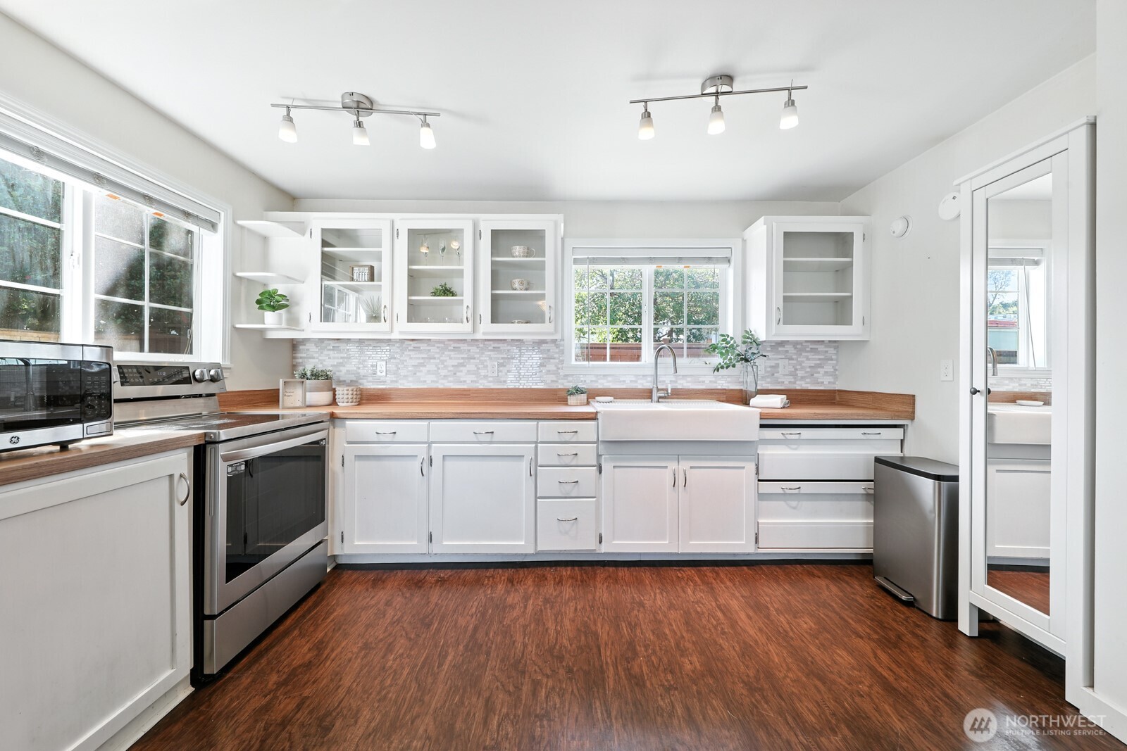 805 36th Street Anacortes, WA 98221 - Photo 6 of 39 a kitchen with a sink stove and cabinets