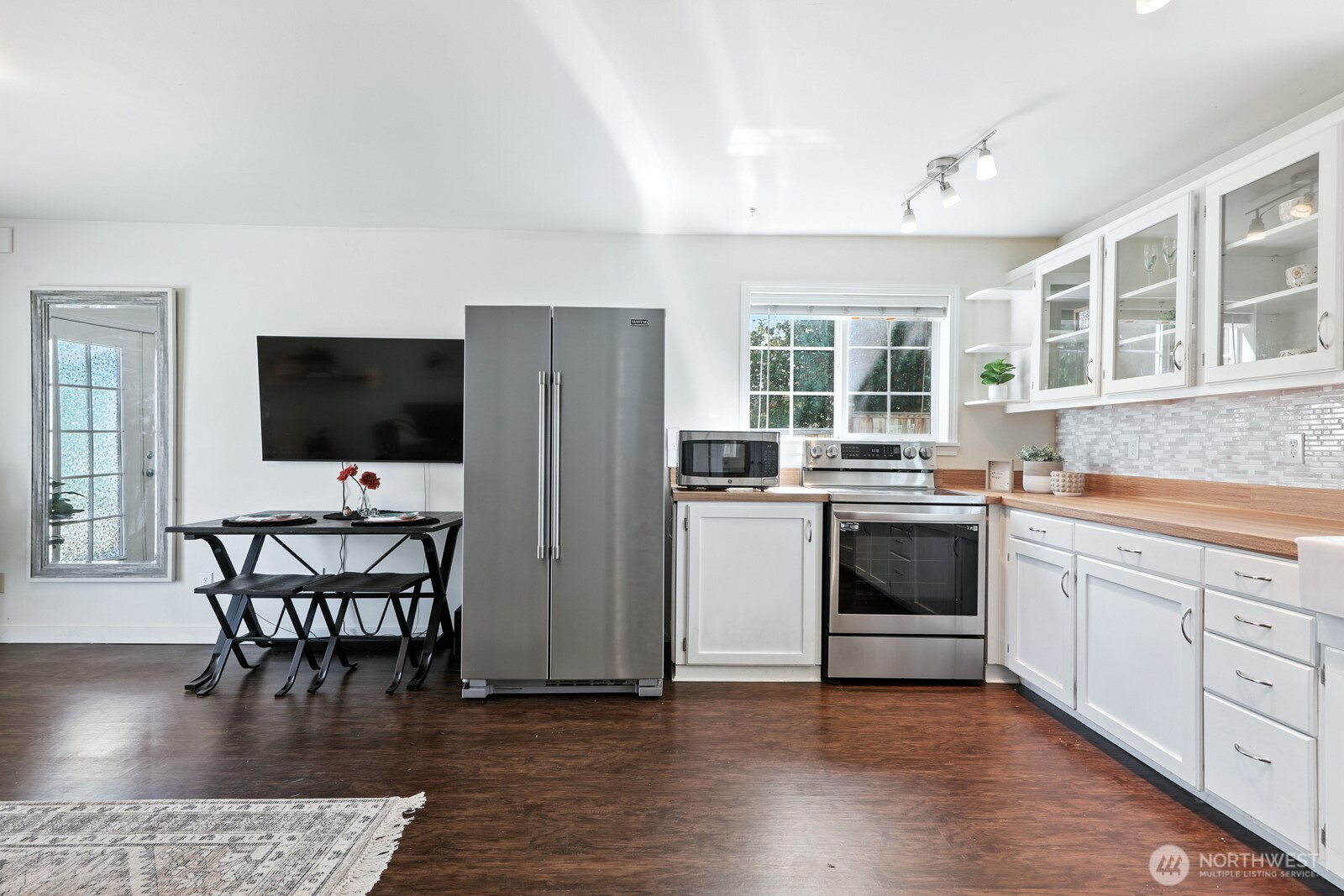 805 36th Street Anacortes, WA 98221 - Photo 9 of 39 a kitchen with granite countertop a stove a sink and a refrigerator