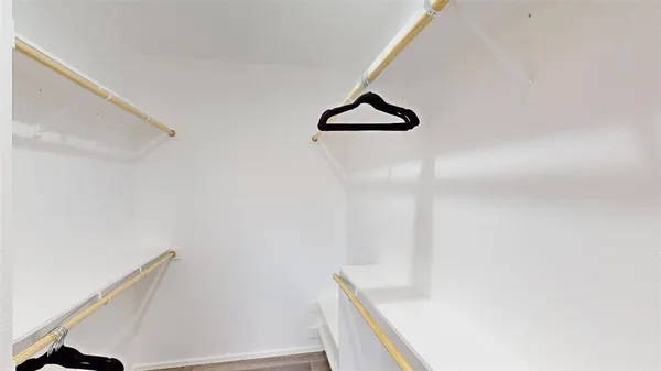 a view of staircase with white walls