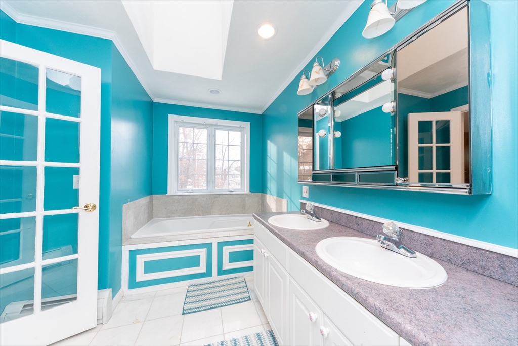 3 Woodruff Road Clinton, MA 01510 - Photo 15 of 22 a bathroom with a granite countertop tub and a large window