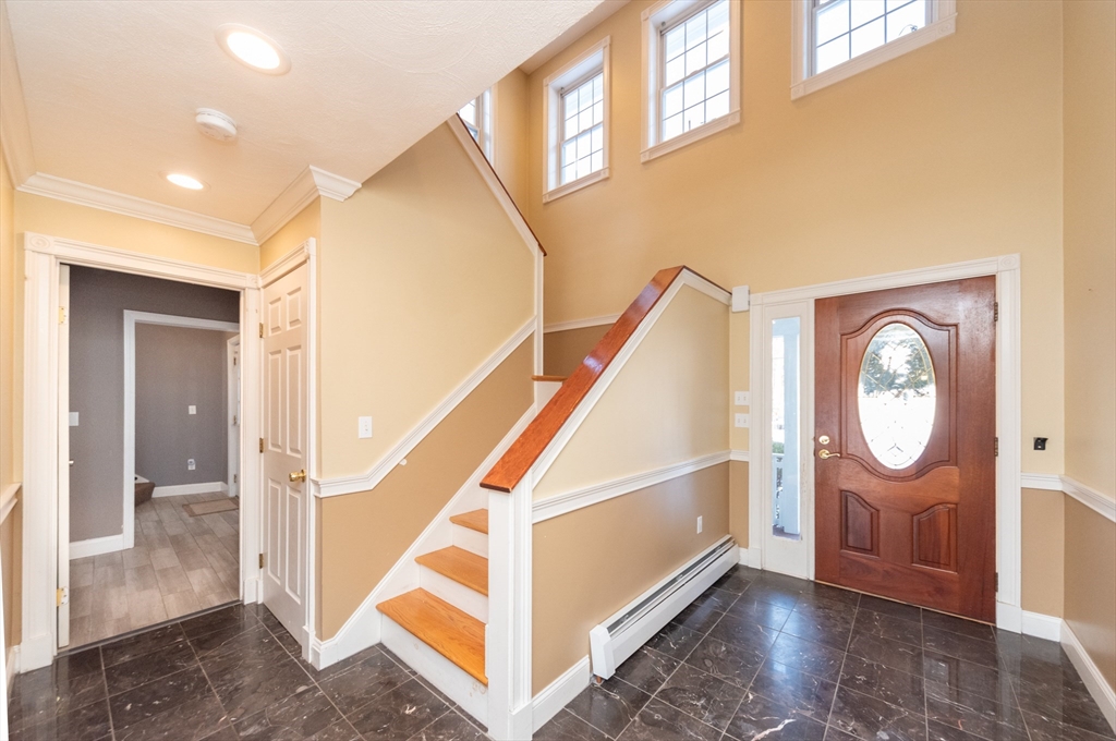 3 Woodruff Road Clinton, MA 01510 - Photo 7 of 22 a view of entryway with wooden floor and door