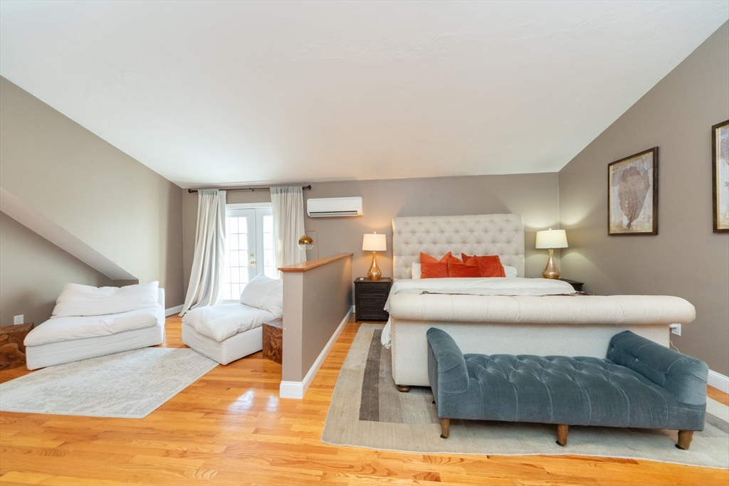 3 Woodruff Road Clinton, MA 01510 - Photo 8 of 22 a bedroom with a bed and wooden floor