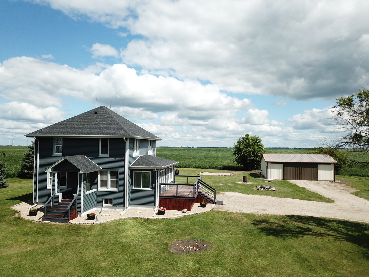10640 South Johnny Run Road Kinsman, IL 60437 - Photo 3 of 19 a view of a house with backyard porch and sitting area