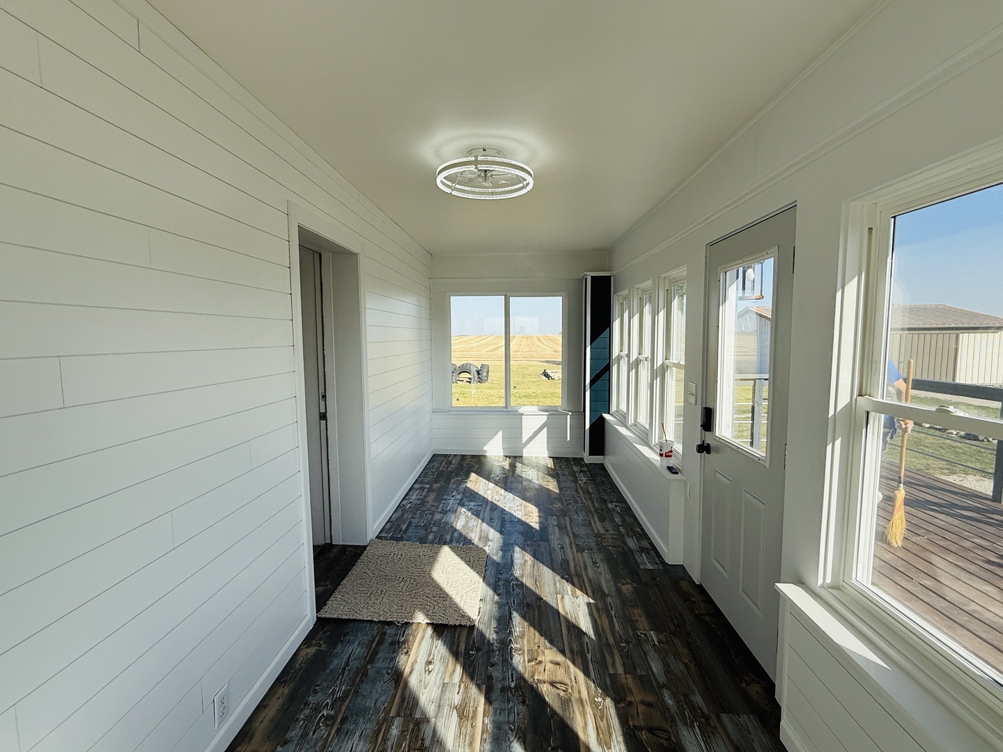 10640 South Johnny Run Road Kinsman, IL 60437 - Photo 10 of 19 a view of a hallway with furniture and windows