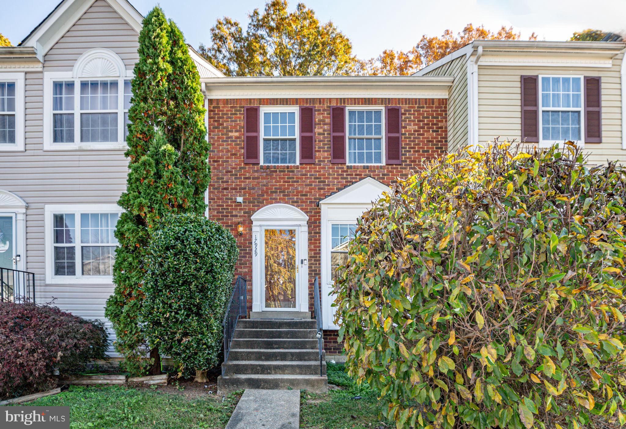 17929 Milroy Drive Dumfries, VA 22026 - Photo 1 of 36 a front view of a house with a garden