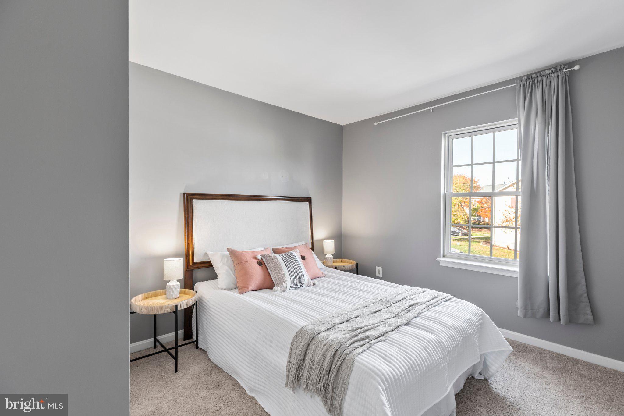 17929 Milroy Drive Dumfries, VA 22026 - Photo 17 of 36 a bedroom with a bed and window