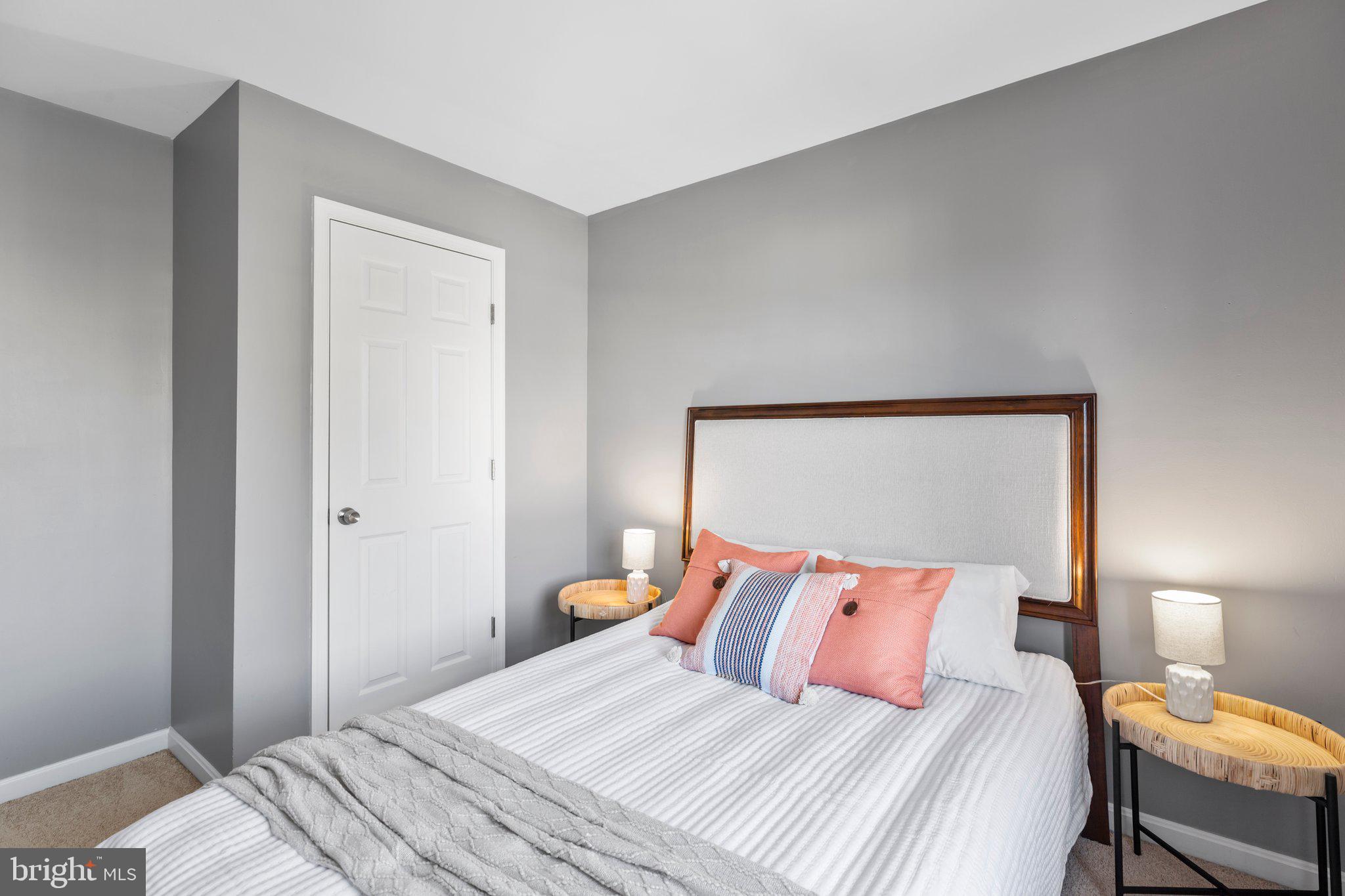 17929 Milroy Drive Dumfries, VA 22026 - Photo 18 of 36 a bedroom with a bed and a lamp