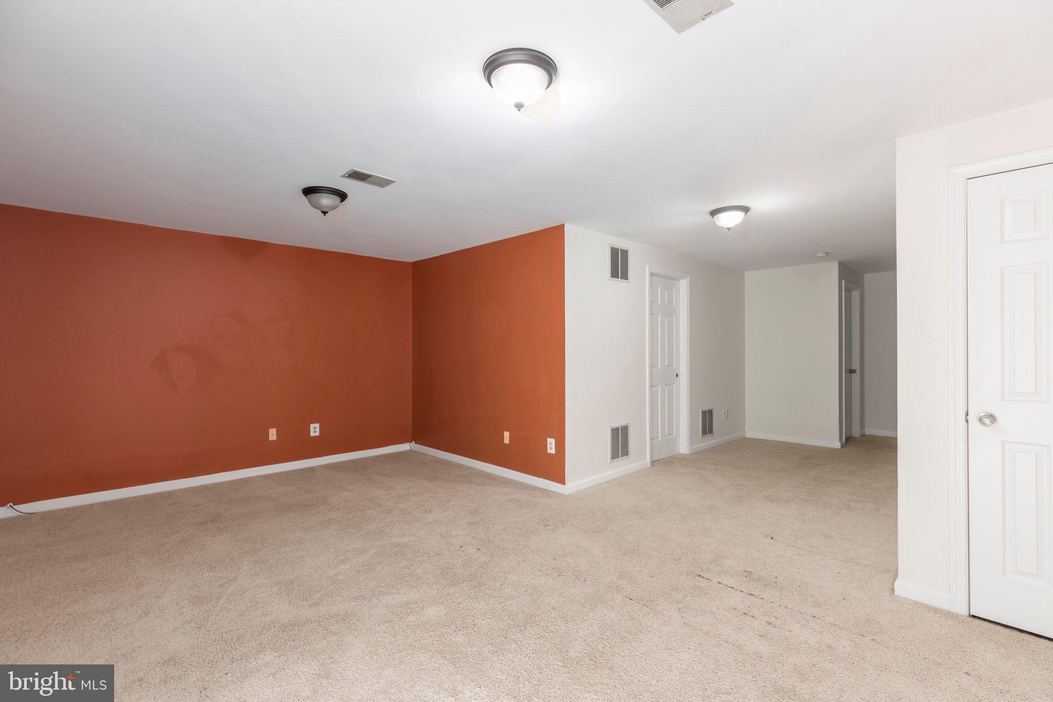 17929 Milroy Drive Dumfries, VA 22026 - Photo 26 of 36 an empty room with closet and entryway