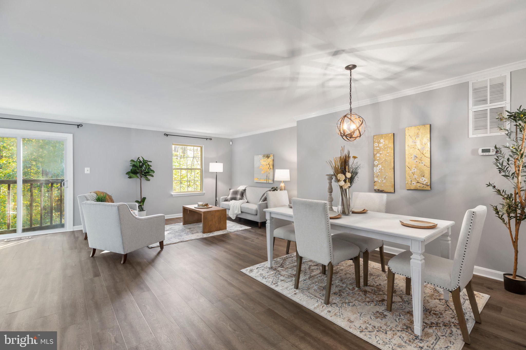 17929 Milroy Drive Dumfries, VA 22026 - Photo 3 of 36 a view of a dining room with furniture window and wooden floor