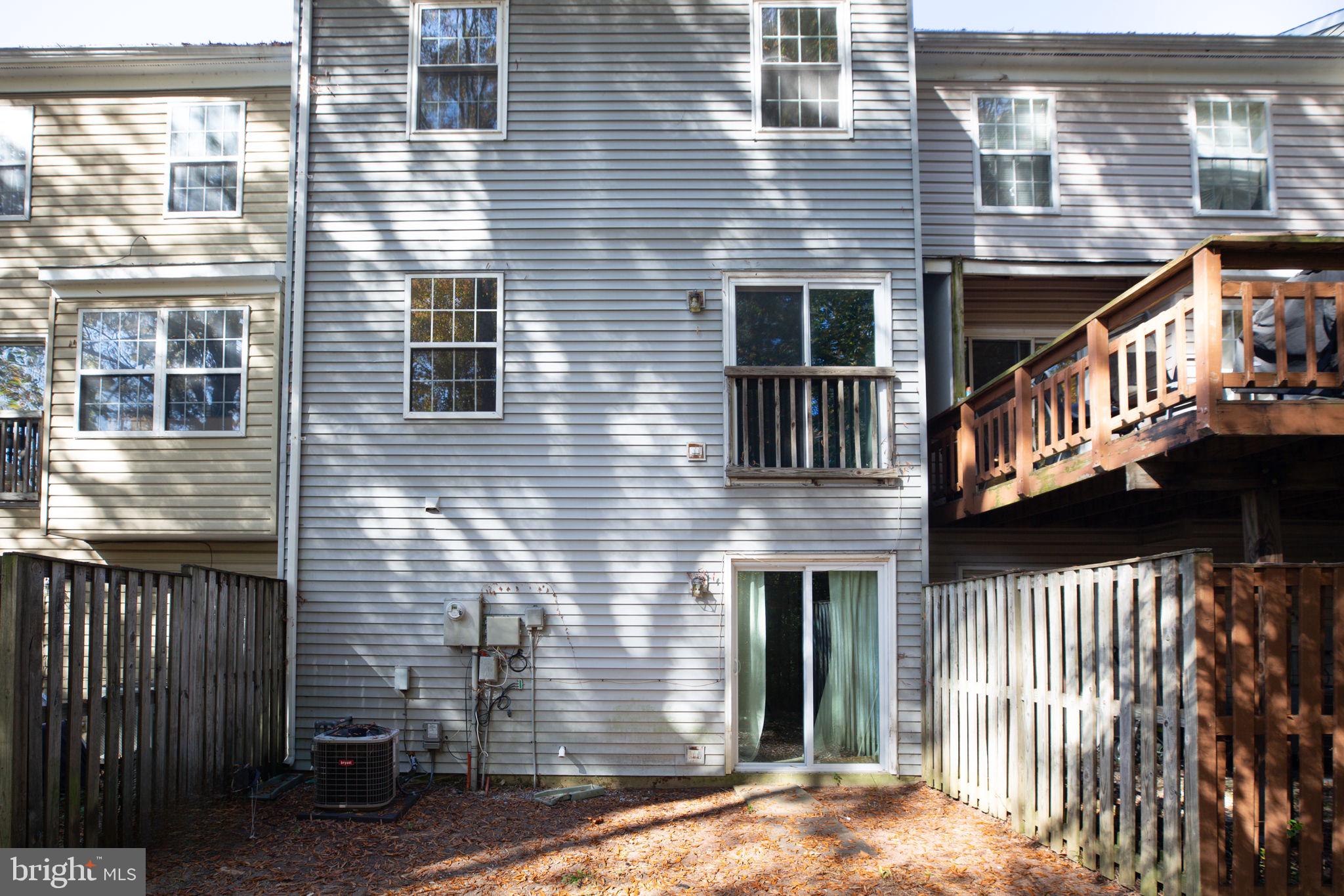 17929 Milroy Drive Dumfries, VA 22026 - Photo 33 of 36 a view of a house with a yard and balcony