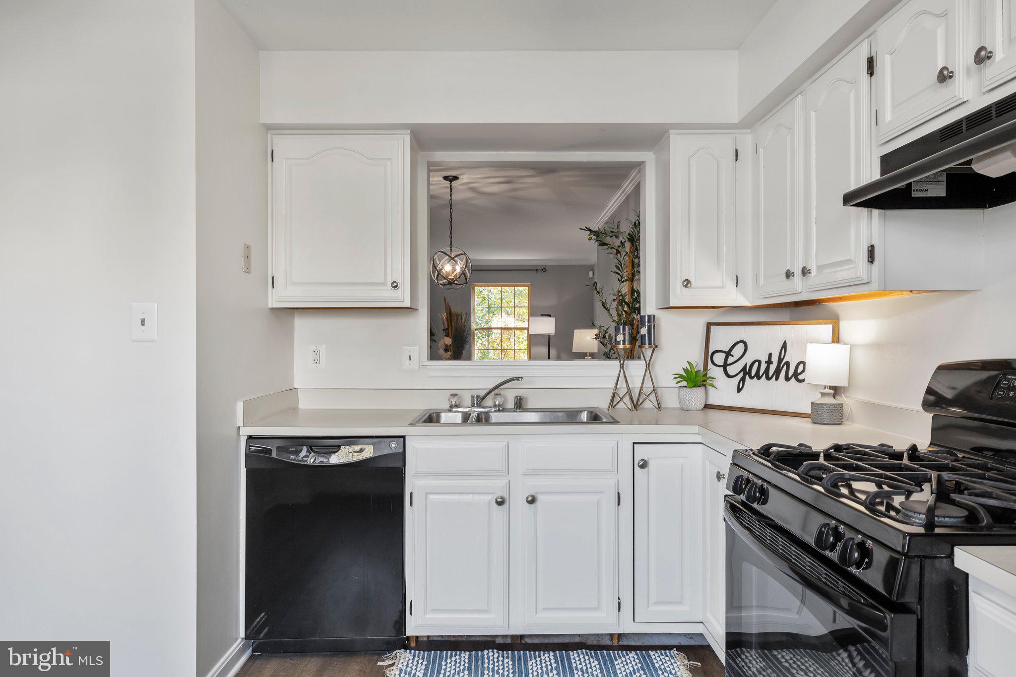 17929 Milroy Drive Dumfries, VA 22026 - Photo 7 of 36 a kitchen with stainless steel appliances granite countertop a stove and a sink