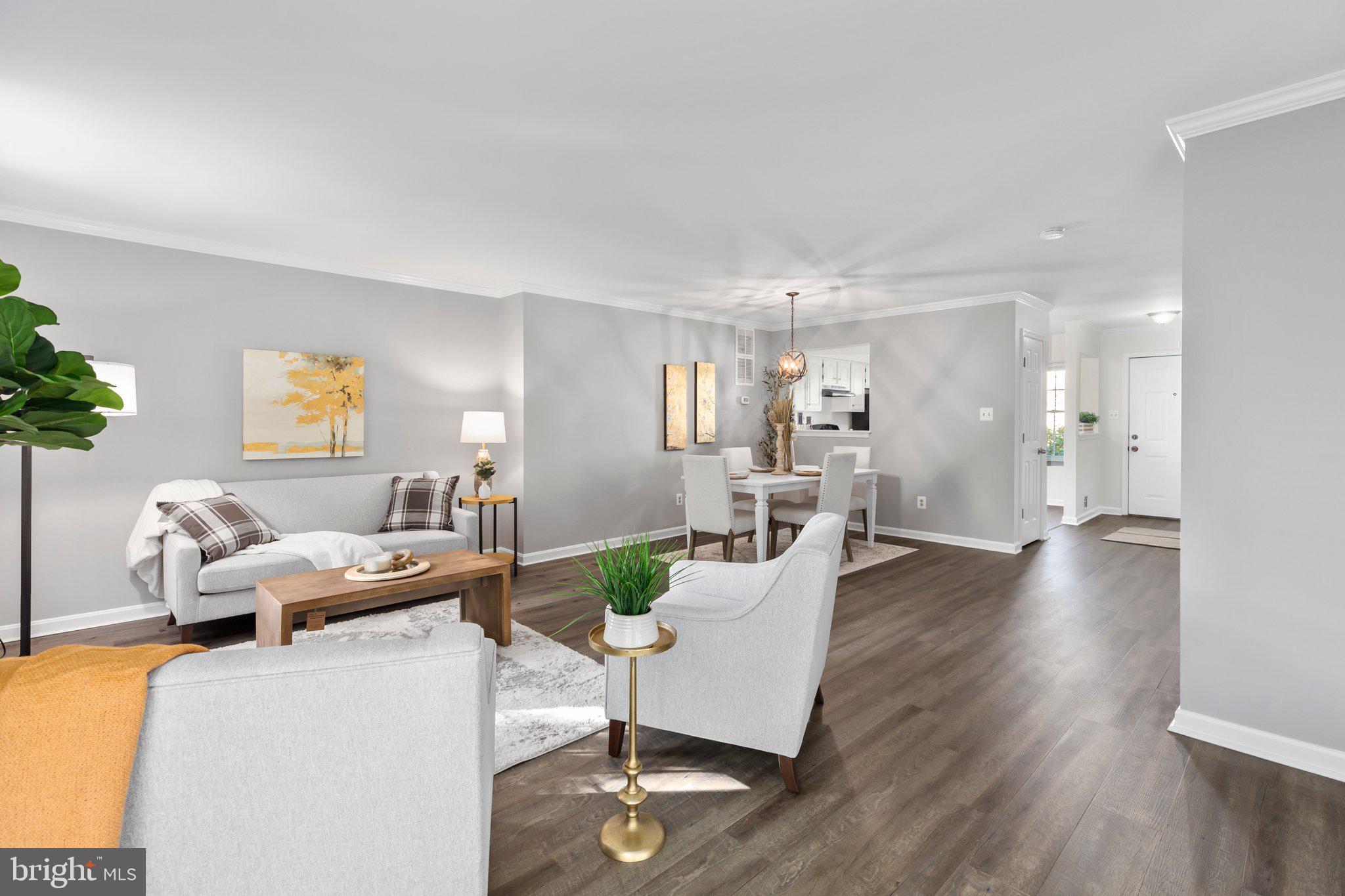 17929 Milroy Drive Dumfries, VA 22026 - Photo 9 of 36 a living room with furniture and wooden floor