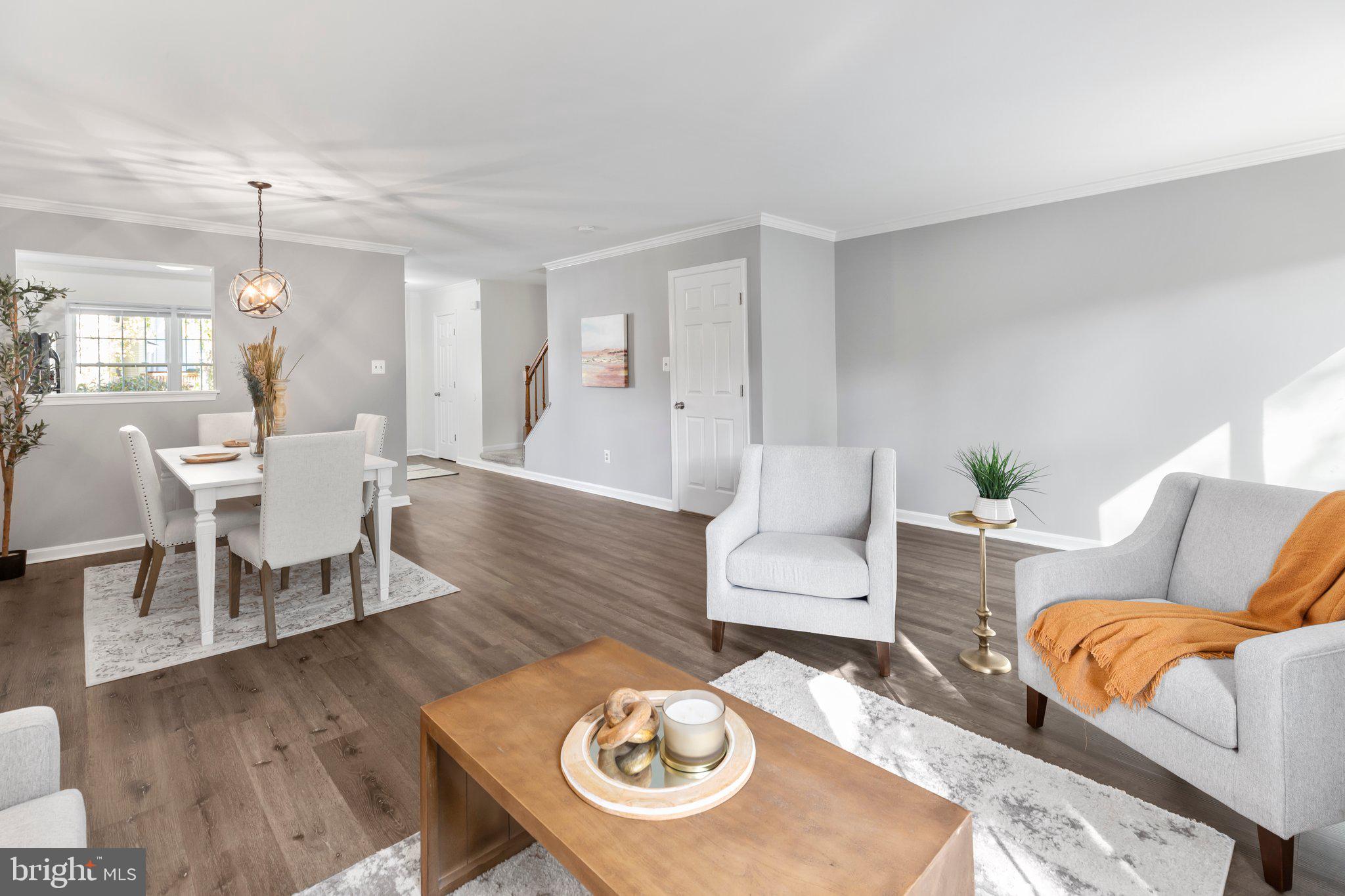 17929 Milroy Drive Dumfries, VA 22026 - Photo 10 of 36 a living room with furniture and a wooden floor
