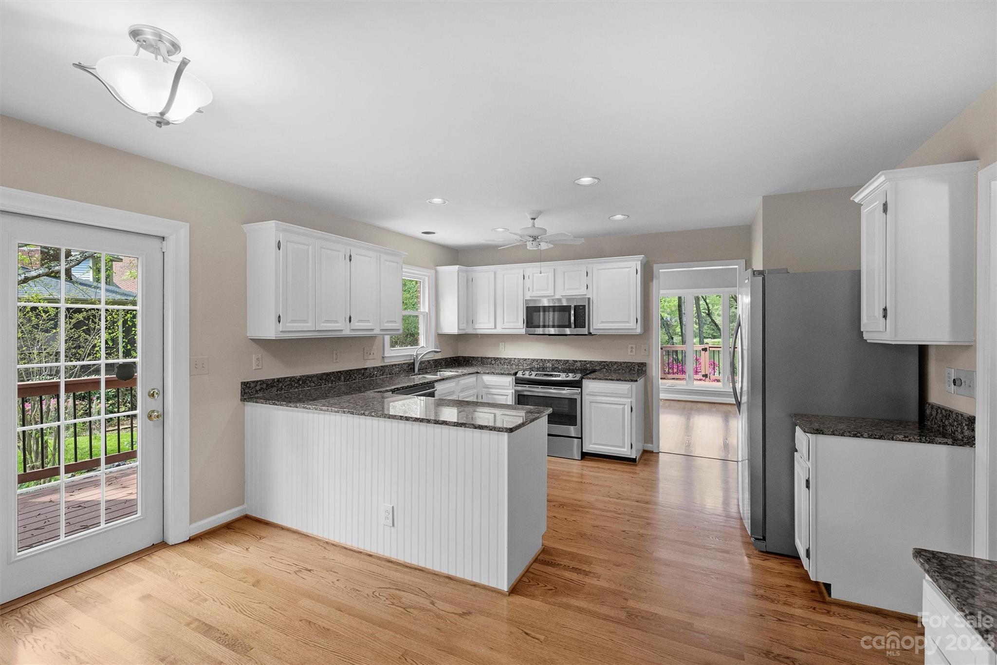 4724 Carson's Pond Road, Unit 104 Charlotte, NC 28226 - Photo 14 of 38 a kitchen with stainless steel appliances a stove a sink and a refrigerator