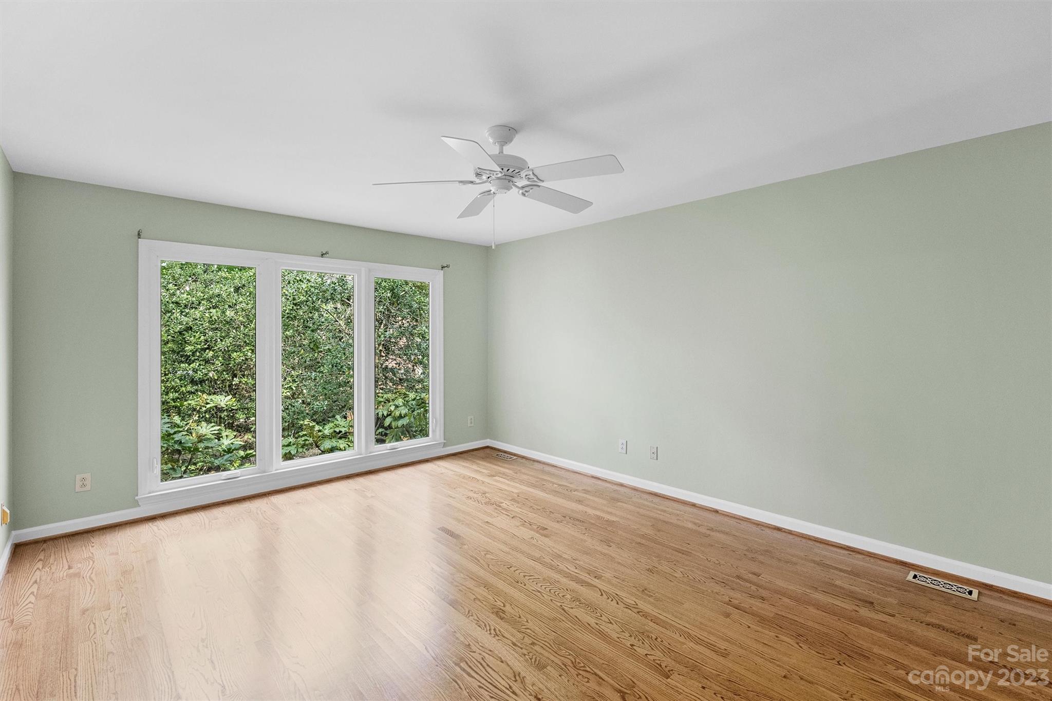 4724 Carson's Pond Road, Unit 104 Charlotte, NC 28226 - Photo 16 of 38 wooden floor in an empty room with a window