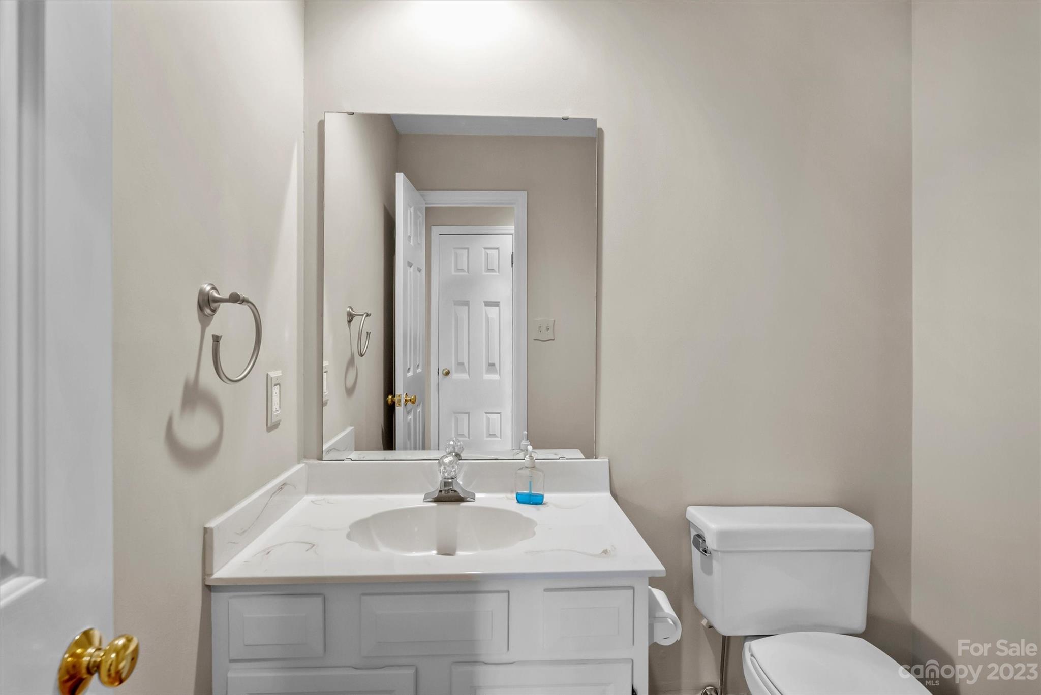 4724 Carson's Pond Road, Unit 104 Charlotte, NC 28226 - Photo 20 of 38 a bathroom with a sink and a mirror