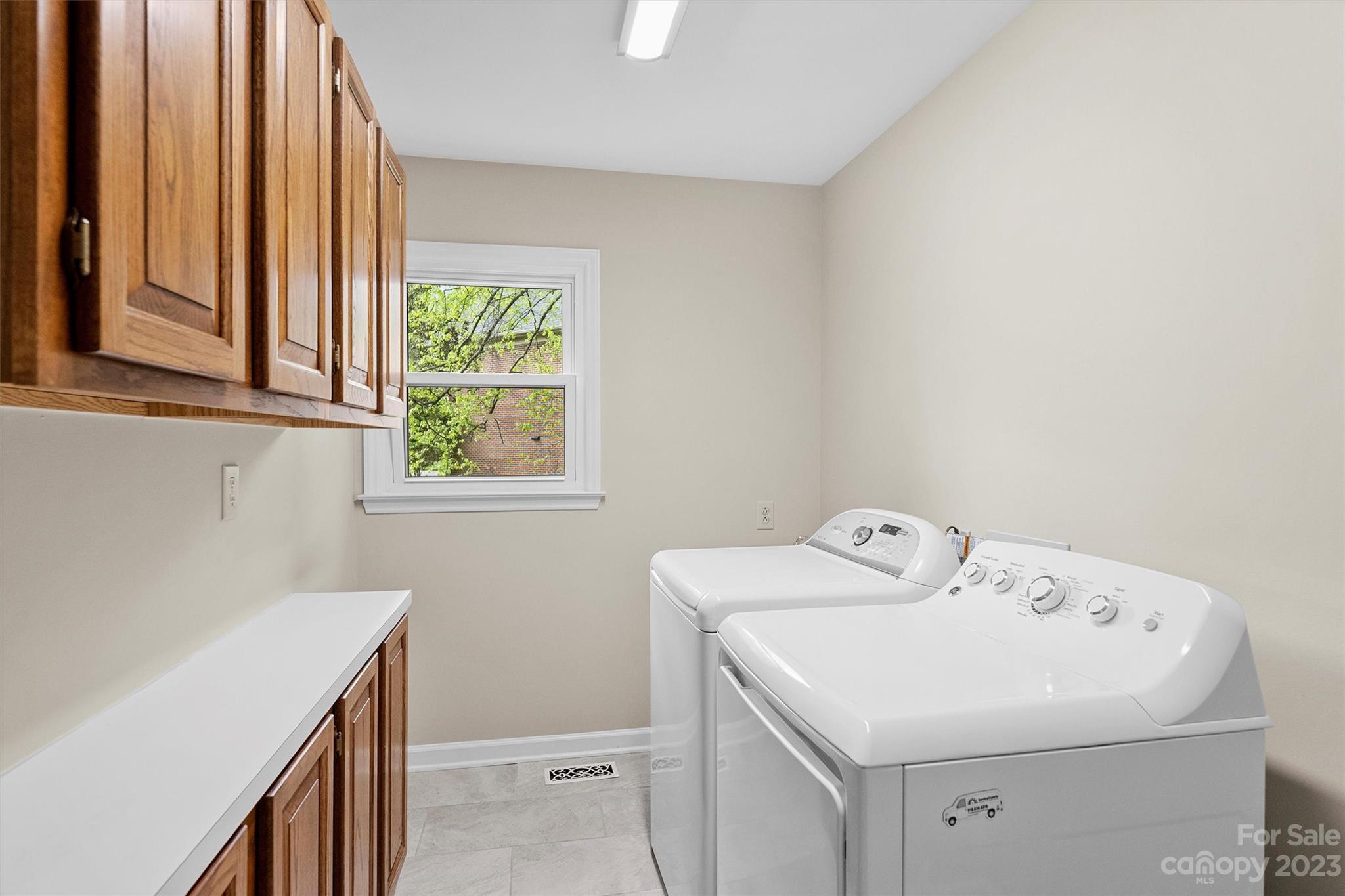 4724 Carson's Pond Road, Unit 104 Charlotte, NC 28226 - Photo 21 of 38 a utility room with dryer and washer
