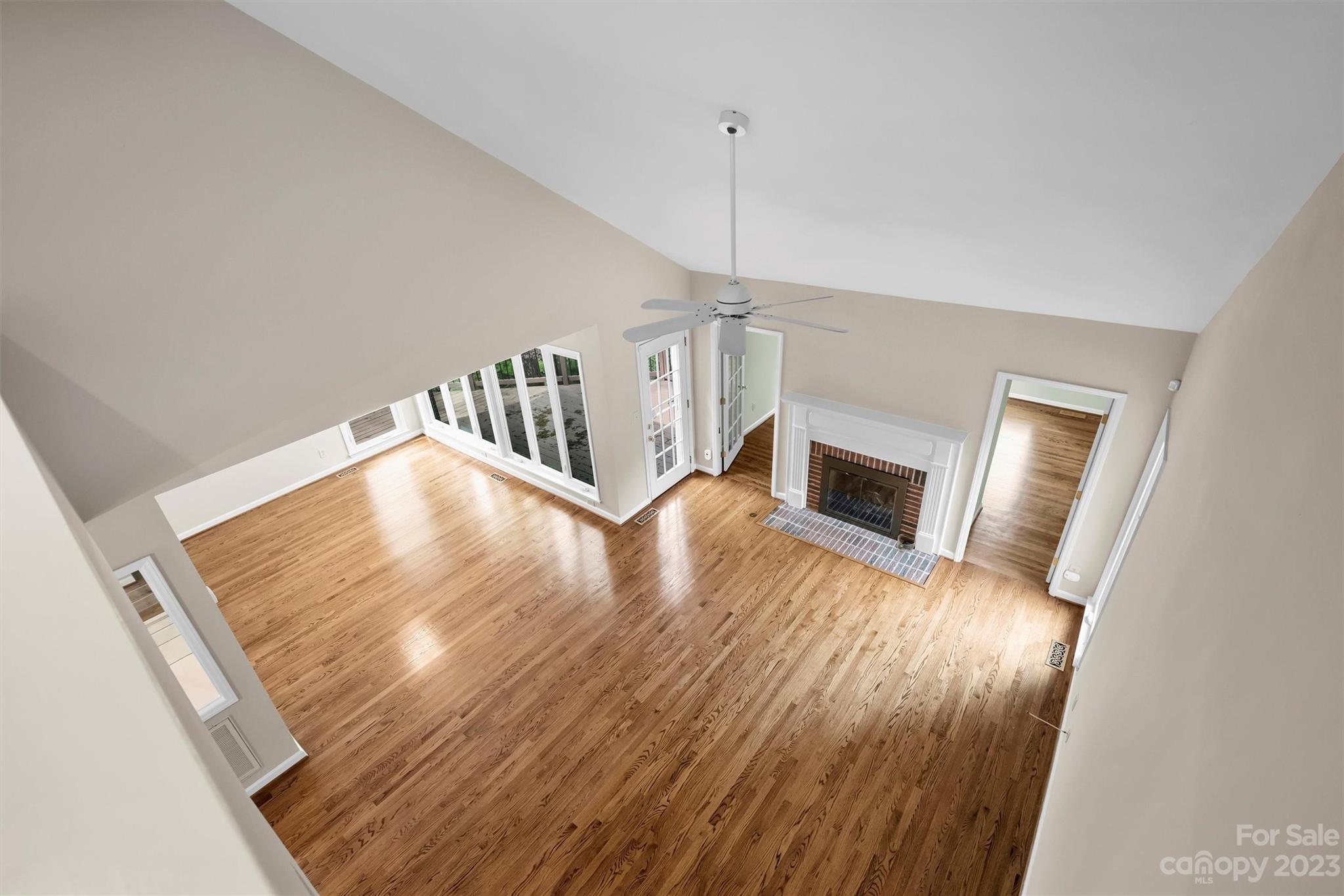 4724 Carson's Pond Road, Unit 104 Charlotte, NC 28226 - Photo 22 of 38 a view of a livingroom with wooden floor and staircase