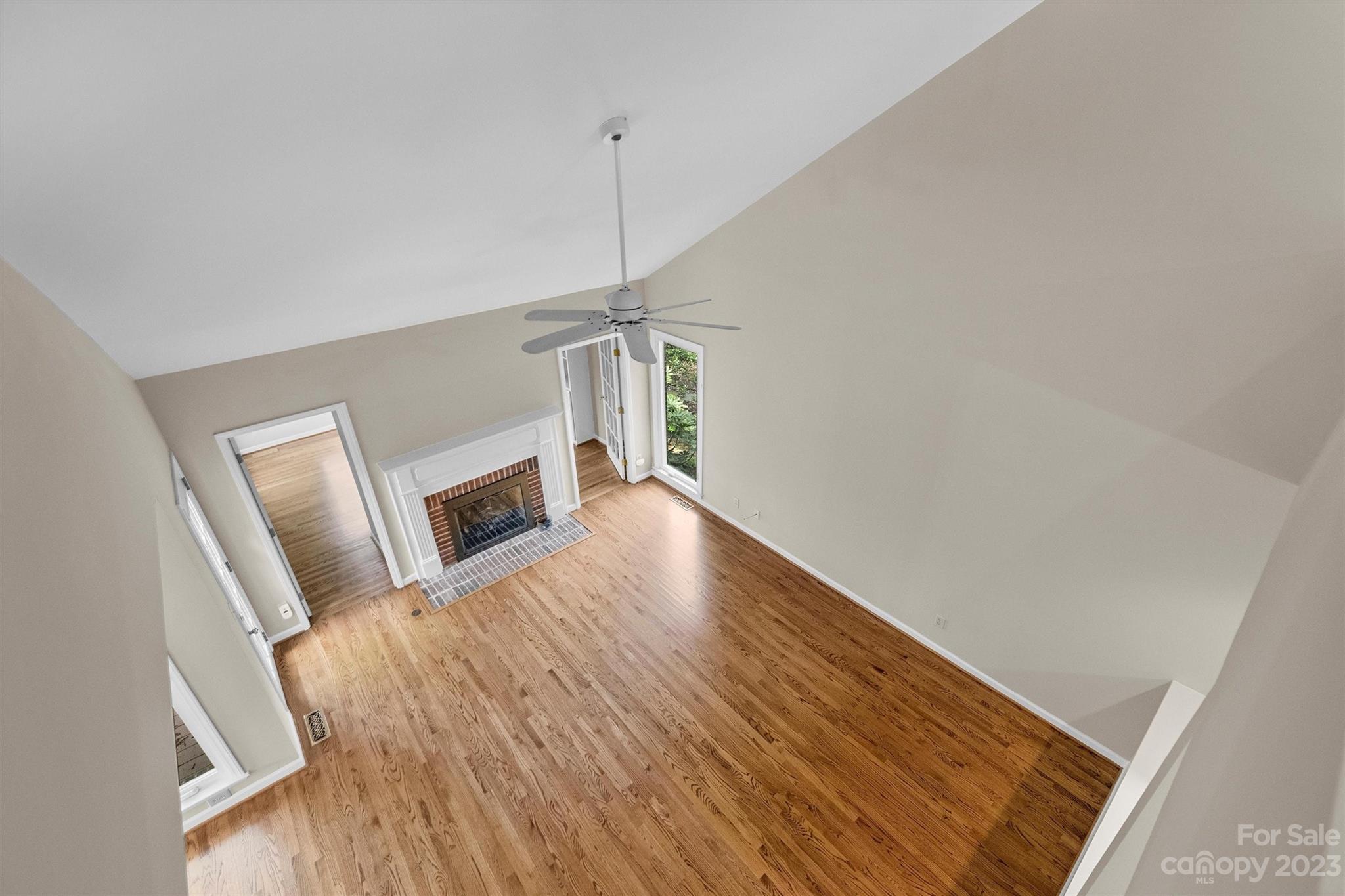 4724 Carson's Pond Road, Unit 104 Charlotte, NC 28226 - Photo 23 of 38 a view of a livingroom with wooden floor and staircase