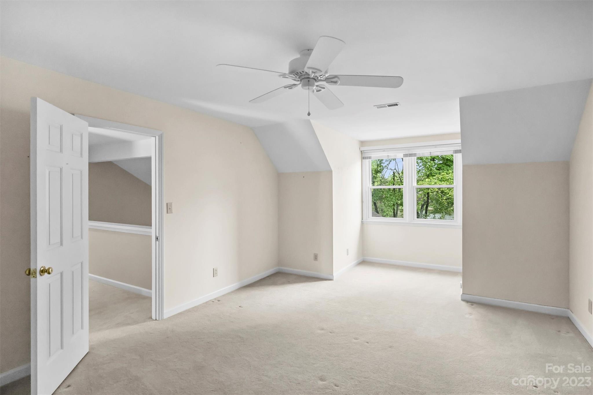 4724 Carson's Pond Road, Unit 104 Charlotte, NC 28226 - Photo 24 of 38 a view of an empty room with a window