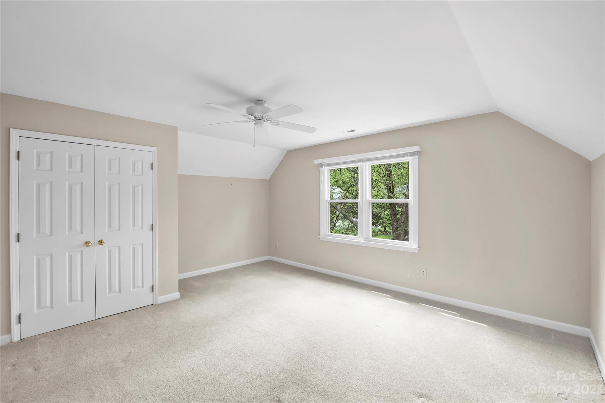 4724 Carson's Pond Road, Unit 104 Charlotte, NC 28226 - Photo 25 of 38 an empty room with a window