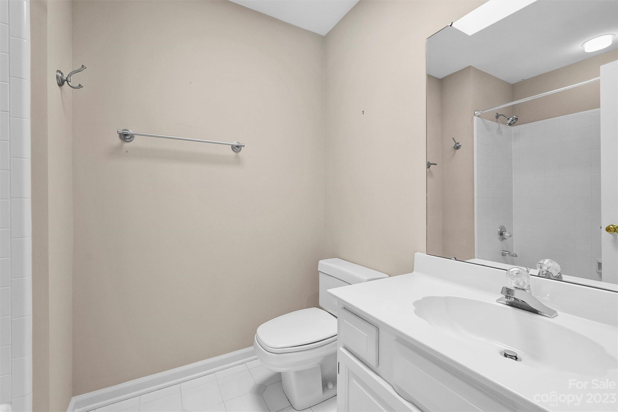 4724 Carson's Pond Road, Unit 104 Charlotte, NC 28226 - Photo 26 of 38 a bathroom with a sink toilet and vanity