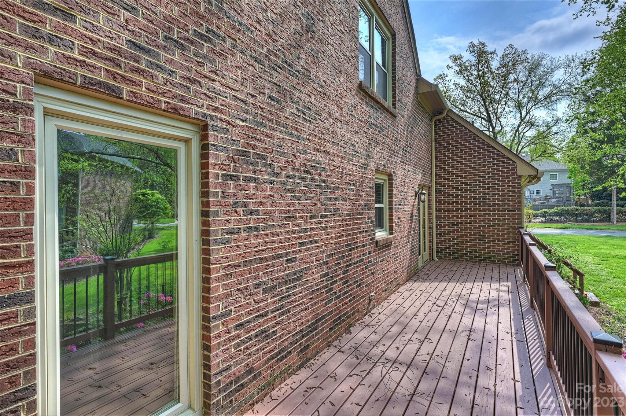 4724 Carson's Pond Road, Unit 104 Charlotte, NC 28226 - Photo 31 of 38 a view of a house with a wooden deck