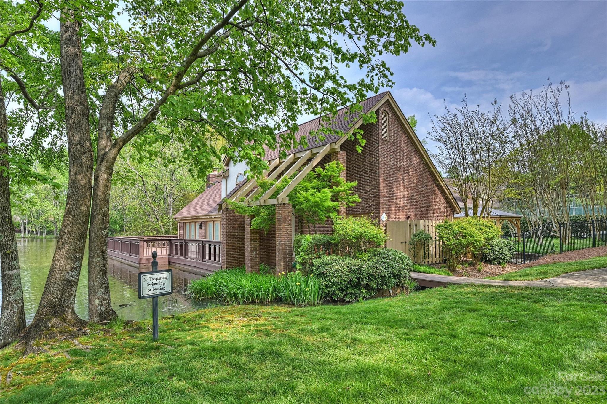 4724 Carson's Pond Road, Unit 104 Charlotte, NC 28226 - Photo 34 of 38 a front view of a house with garden