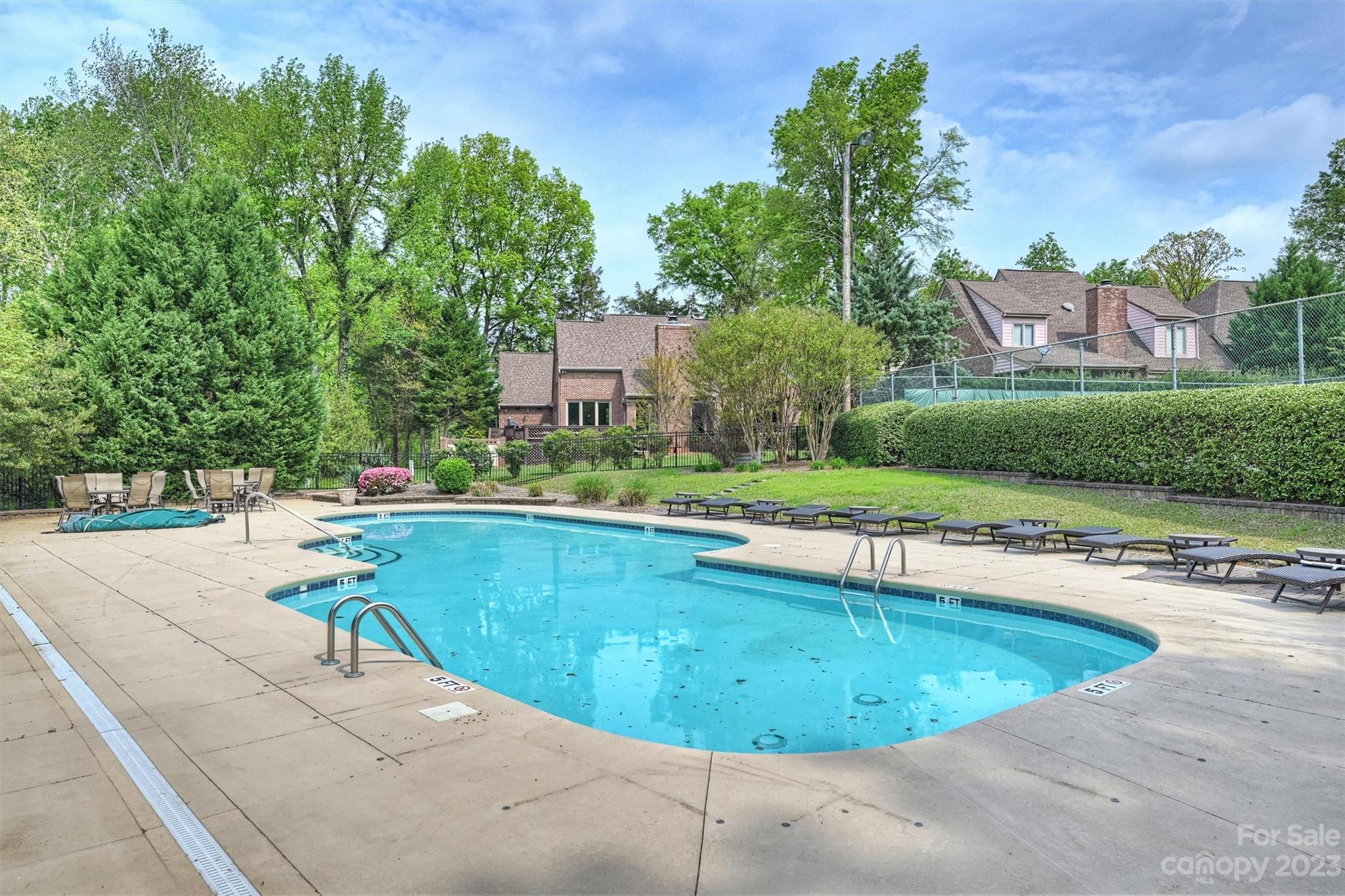 4724 Carson's Pond Road, Unit 104 Charlotte, NC 28226 - Photo 36 of 38 a view of a swimming pool with a patio