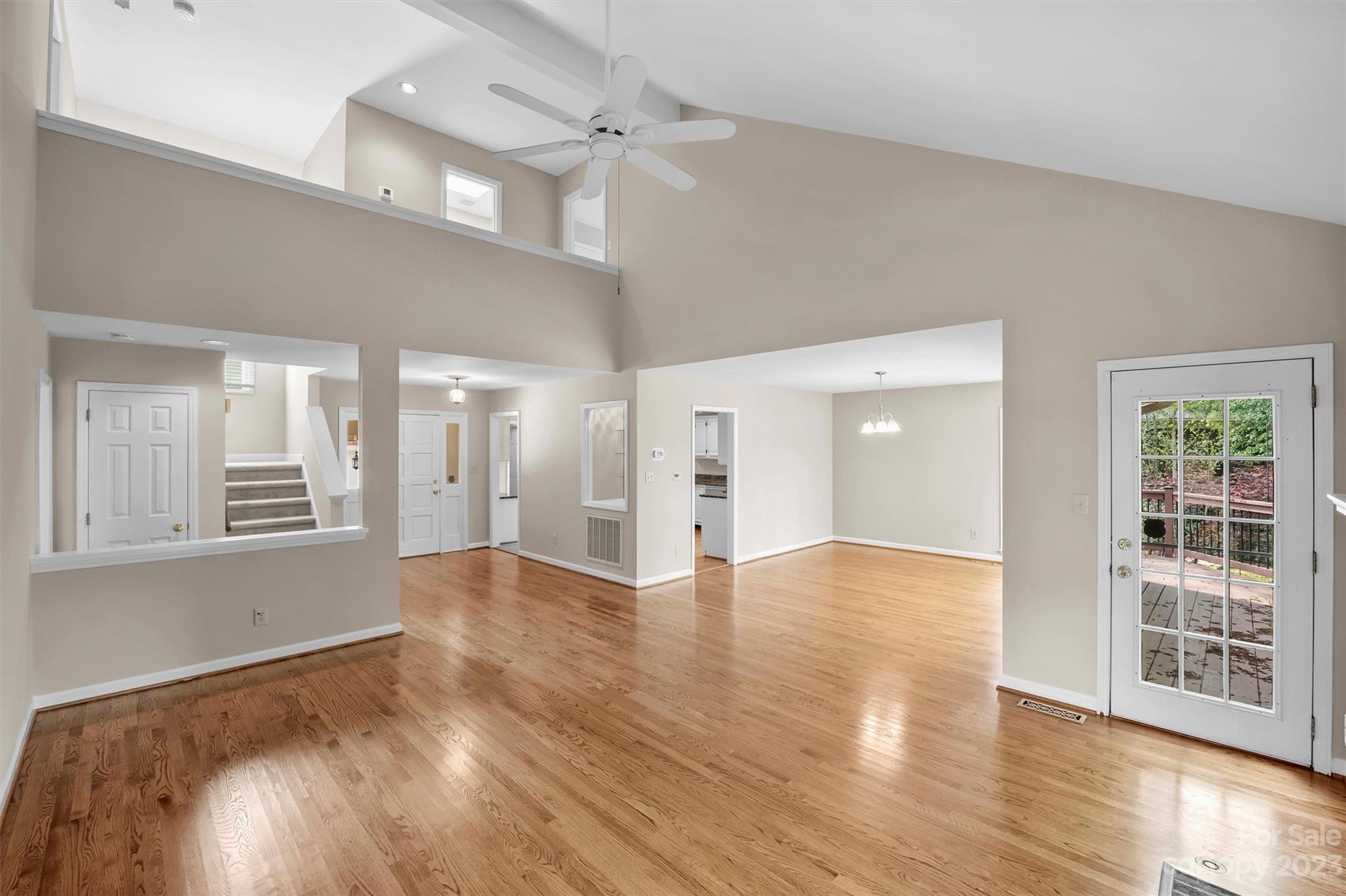 4724 Carson's Pond Road, Unit 104 Charlotte, NC 28226 - Photo 8 of 38 a view of an empty room with wooden floor and a window