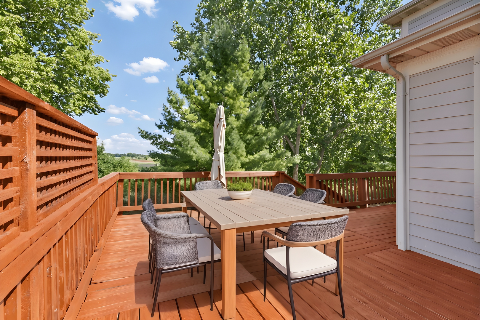 748 Hamilton Way Batavia, IL 60510 - Photo 31 of 36 a balcony with wooden floor table and chairs