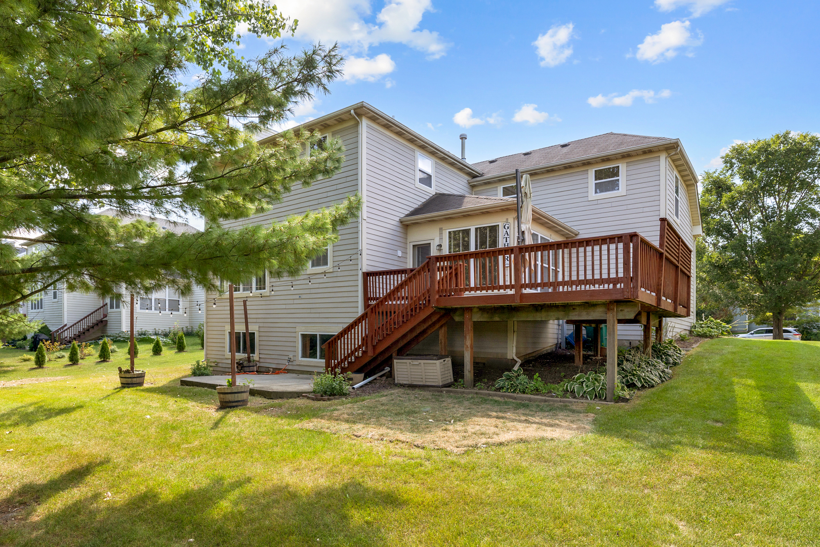 748 Hamilton Way Batavia, IL 60510 - Photo 36 of 36 a front view of a house with swimming pool and sitting area