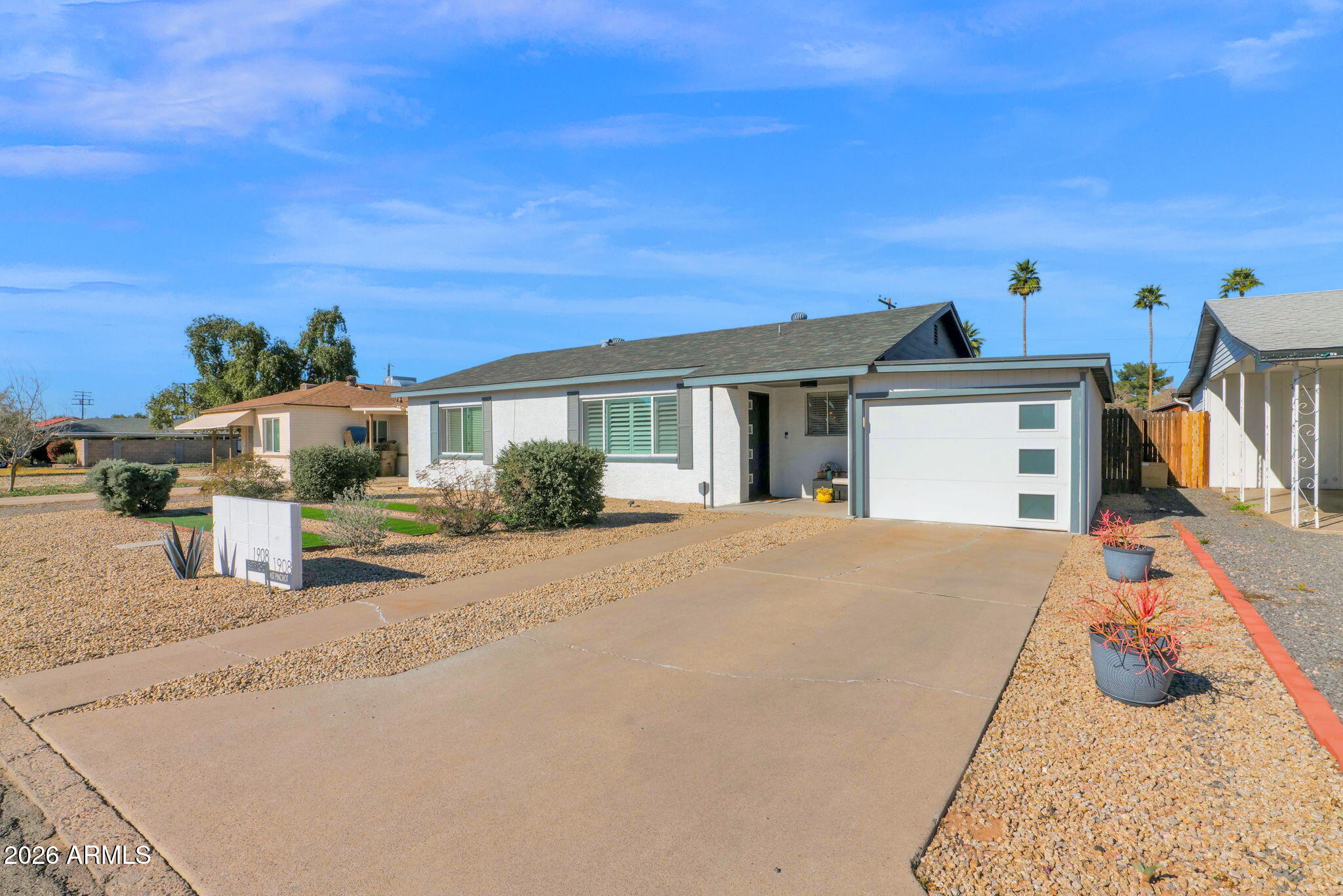 1908 East Pinchot Avenue, Unit 1908 EA Phoenix, AZ 85016 - Photo 1 of 36 a front view of a house with a yard