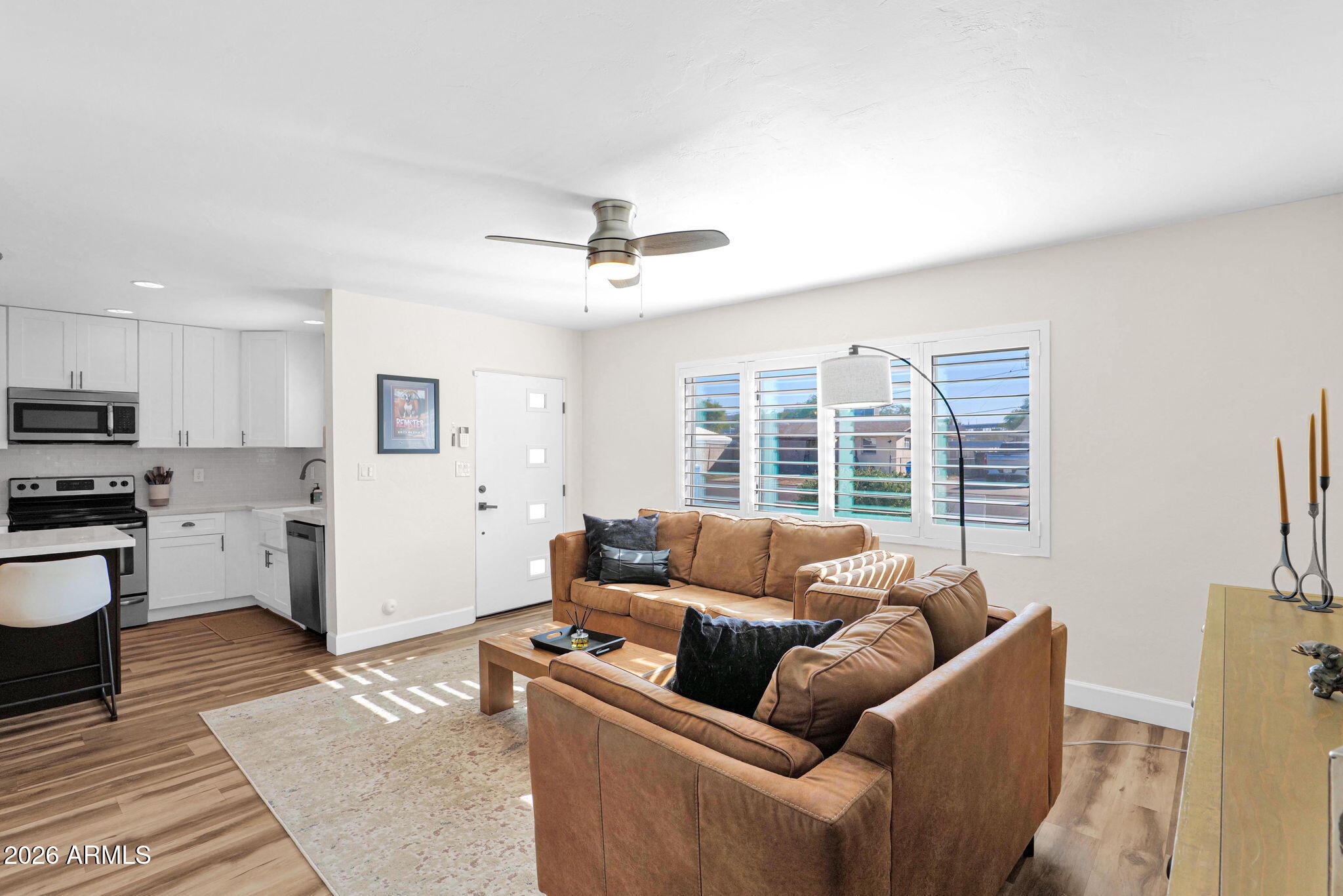 1908 East Pinchot Avenue, Unit 1908 EA Phoenix, AZ 85016 - Photo 13 of 36 a living room with furniture and a large window