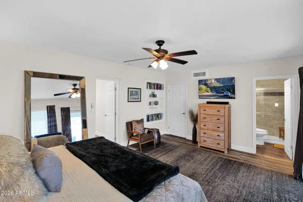 a bedroom with a bed and furniture