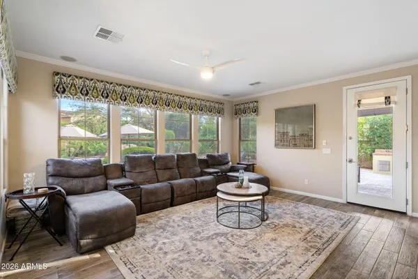 a living room with furniture and a gate