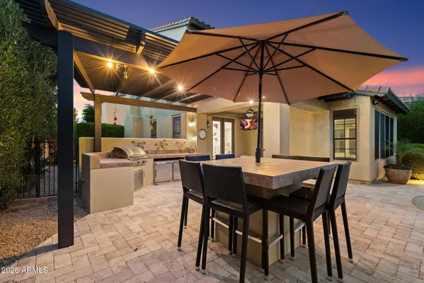 a view of a swimming pool with a table and chairs
