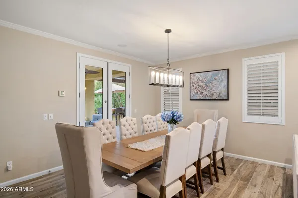 a view of a dining room with furniture window and wooden floor