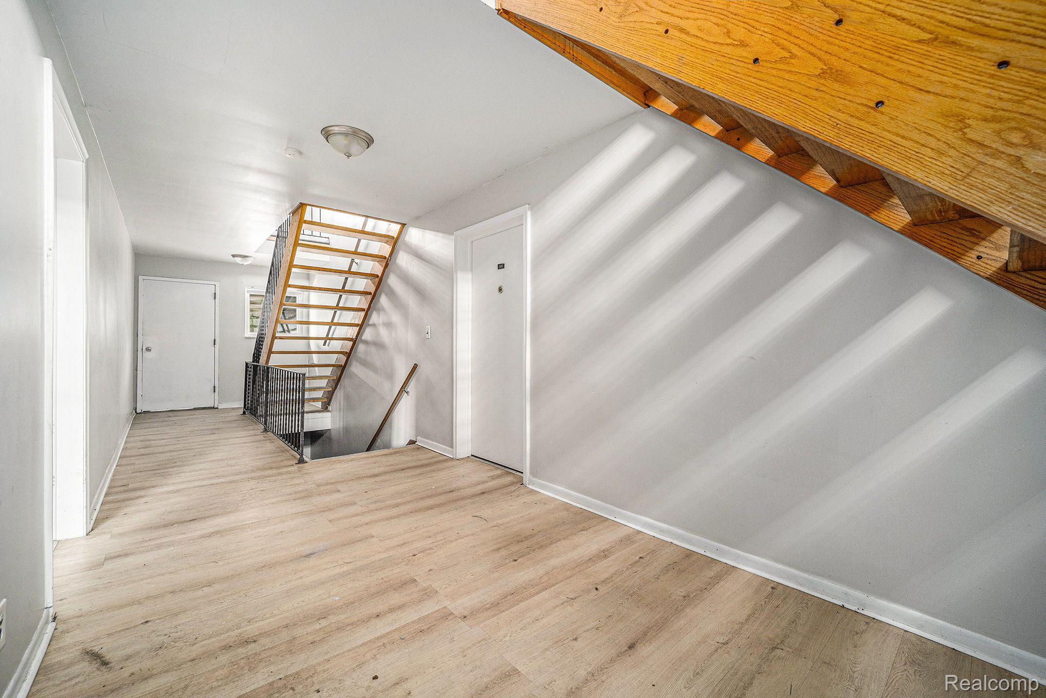 14810 Joy Road Detroit, MI 48228 - Photo 17 of 20 LOWER LEVEL UNITS HALLWAY WITH NEW FLOORING
